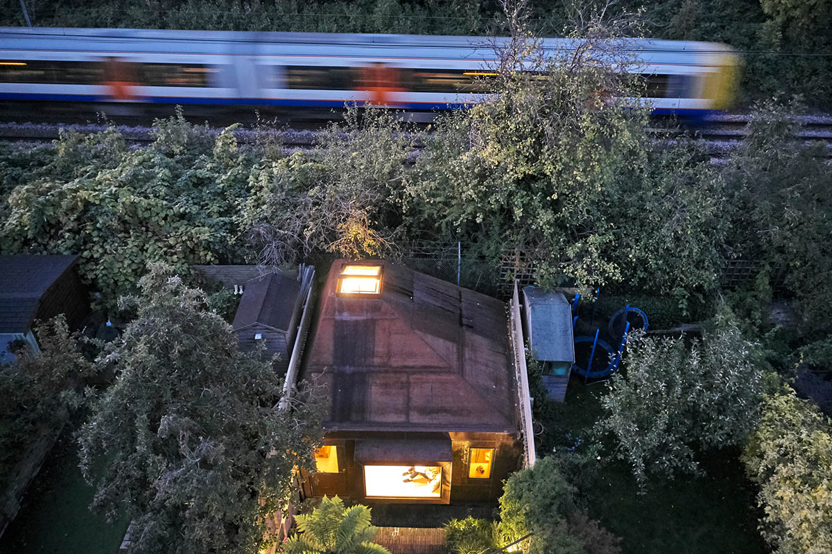 RISE Design Studio built sunken garden studio with rusted steel to provide a hidden place to escape