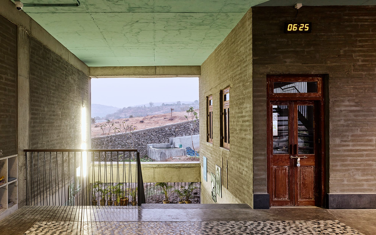 Avasara Academy, resembling an unfinished structure, educates young women in the moorland of Pune