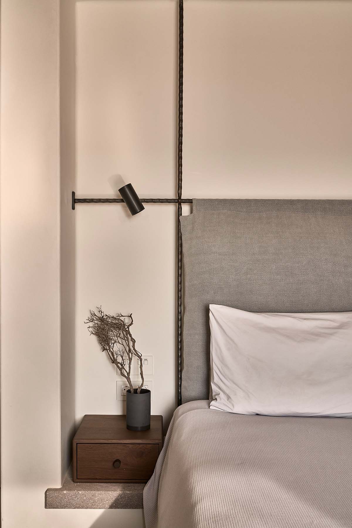 K Studio built small holiday villa with round-edged volumes and shading elements in Mykonos