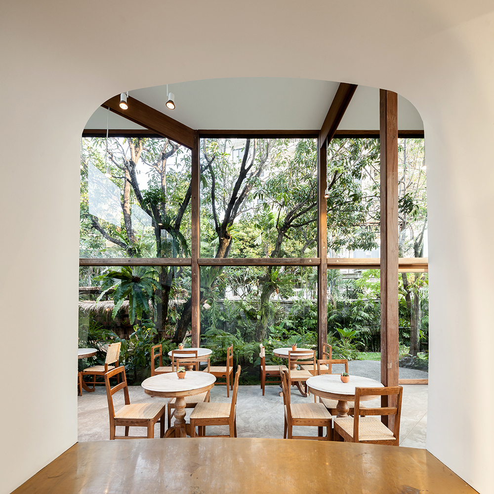 NitaProw designed an elegant transparent beauty shop within coconut trees of  Thonglor in Bangkok