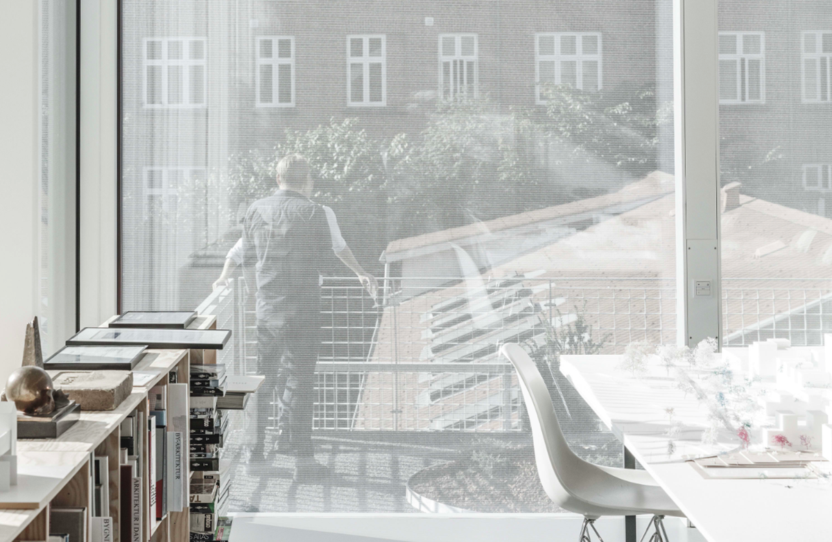 A collage of elements reflecting surroundings assembled on the facade of Office Building by SLETH