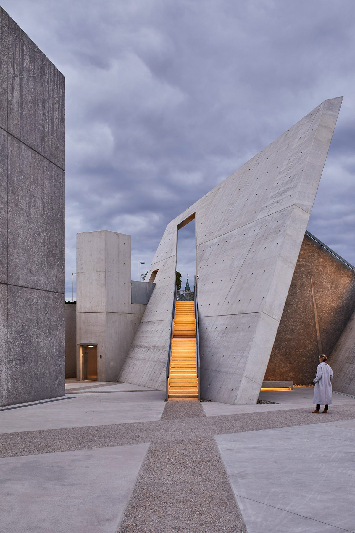 Daniel Libeskind’s Holocaust Monument features fragmented concrete walls creating rough landscape