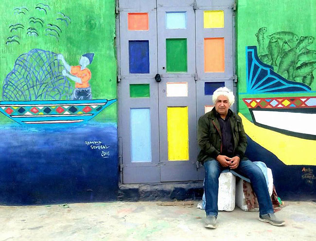 Mona Hassan captures Egyptian Village Festival Houses composed of colourful paintings by 40 artists
