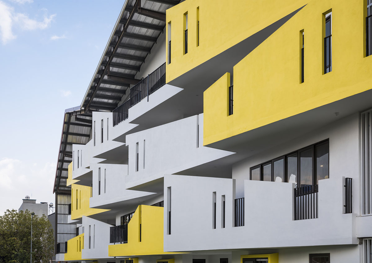 Multi-colored hipped roofs form this kindergarten and primary school in ...