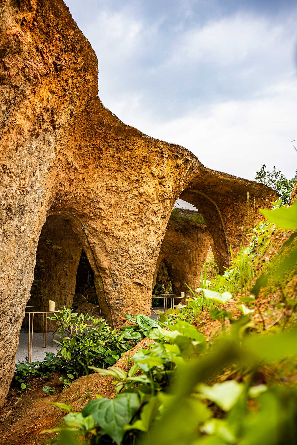 Junya.Ishigami+Associates reveals cave-like house and restaurant in earth form in Japan 
