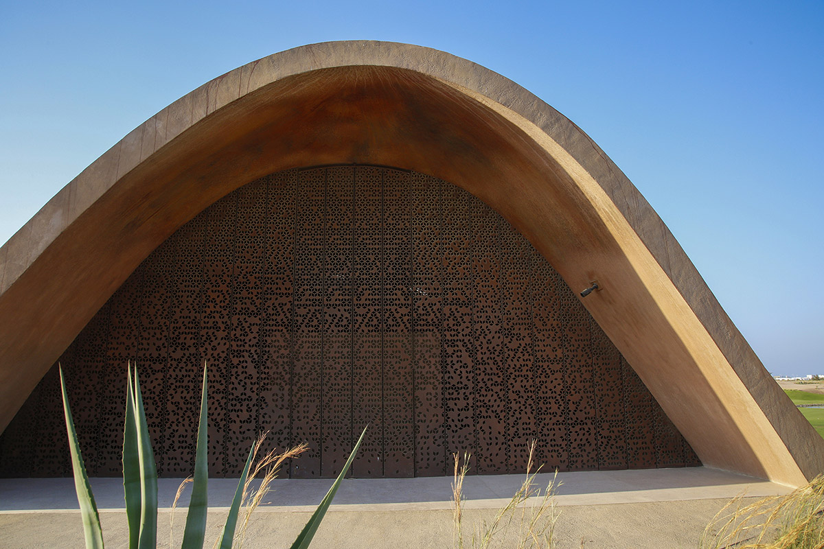 Oppenheim Architecture completes Ayla Golf Academy with wavy roofs in deserted landscape of Jordan