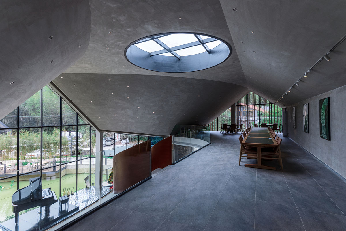 Wildurban Architects completes restaurant with cave-like roof in a forest in Huizhou, China