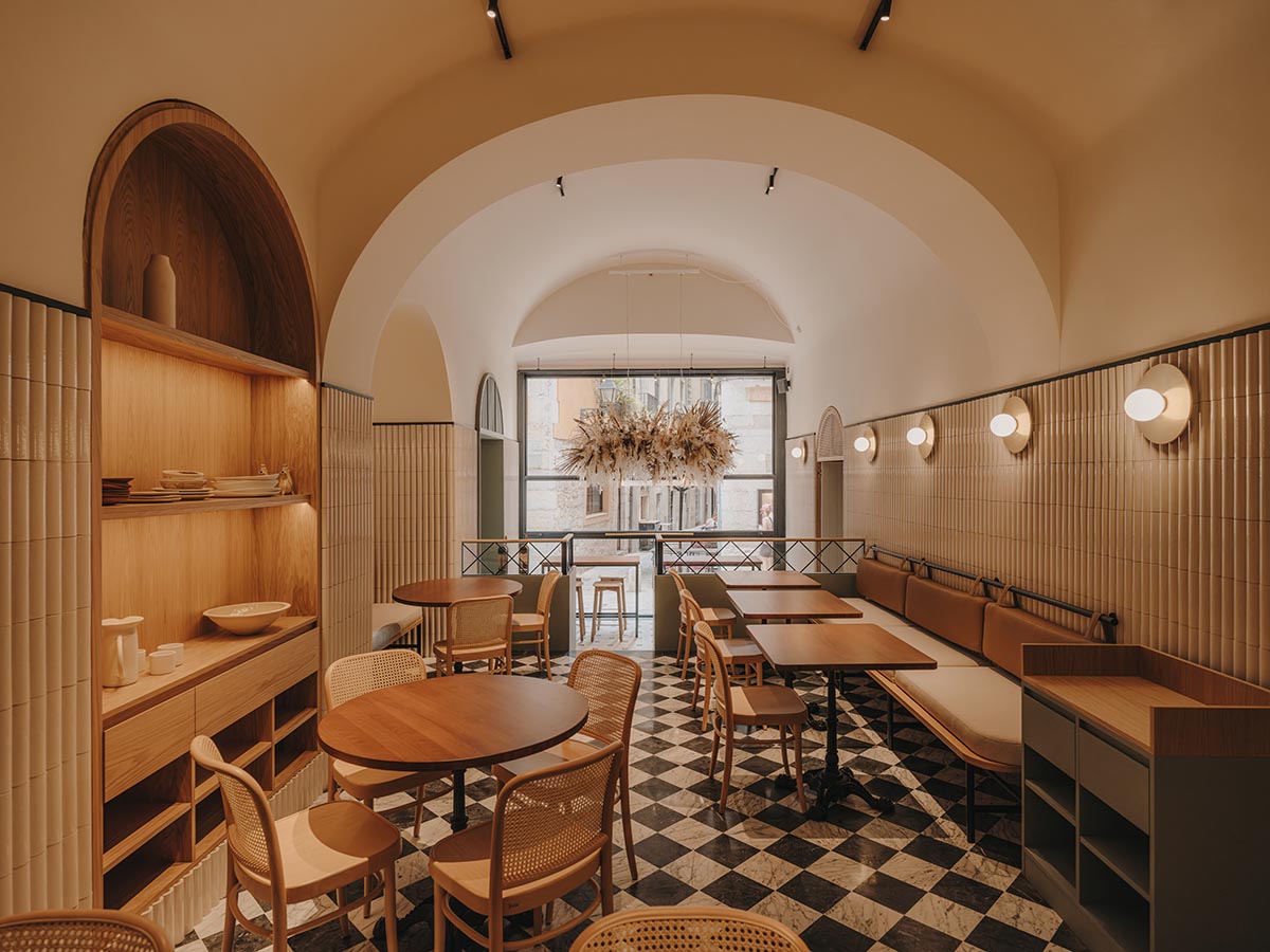 El Equipo Creativo converts 18th-century palace into hotel with rich textures and colors in Girona