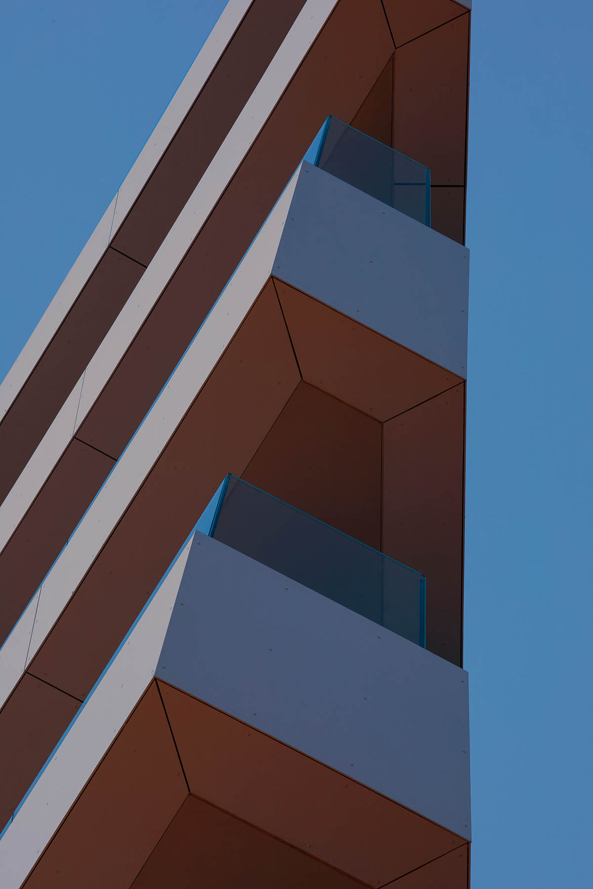 Sharp triangular balconies define this residential block designed by STARH in Bulgaria