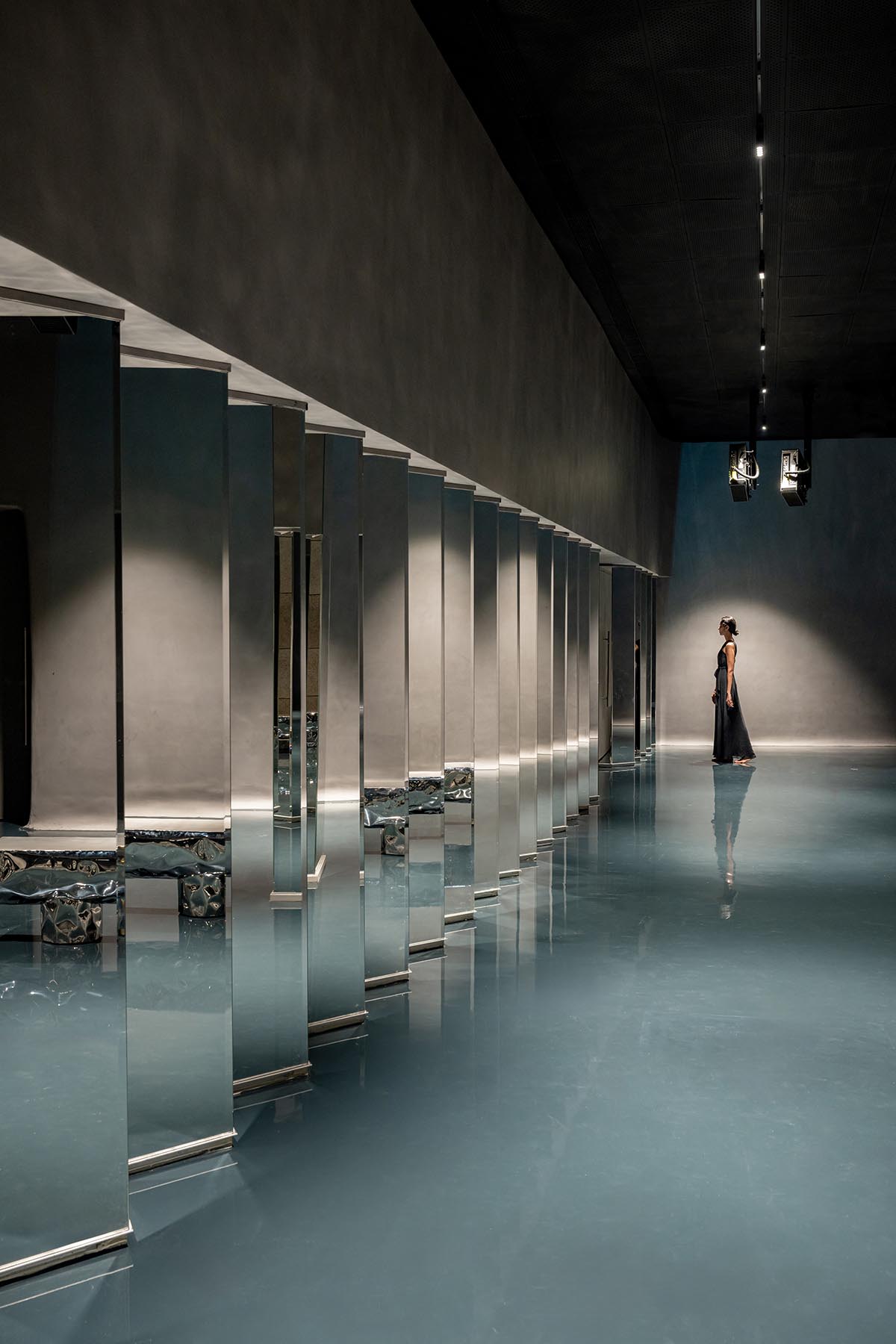 Grey fluid concrete wraps Aatma Manthan Museum by Sanjay Puri Architects