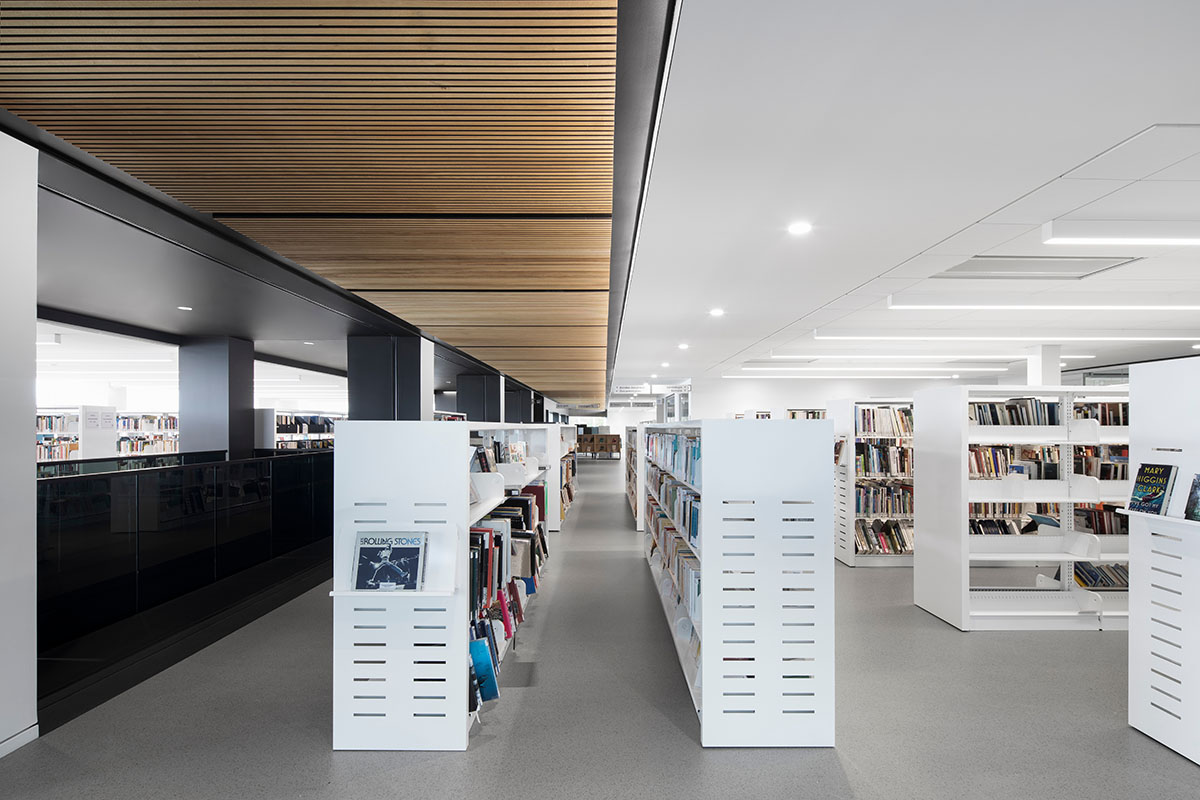 Whitish glass library designed by ACDF Architecture acts as a white floating volume in Quebec