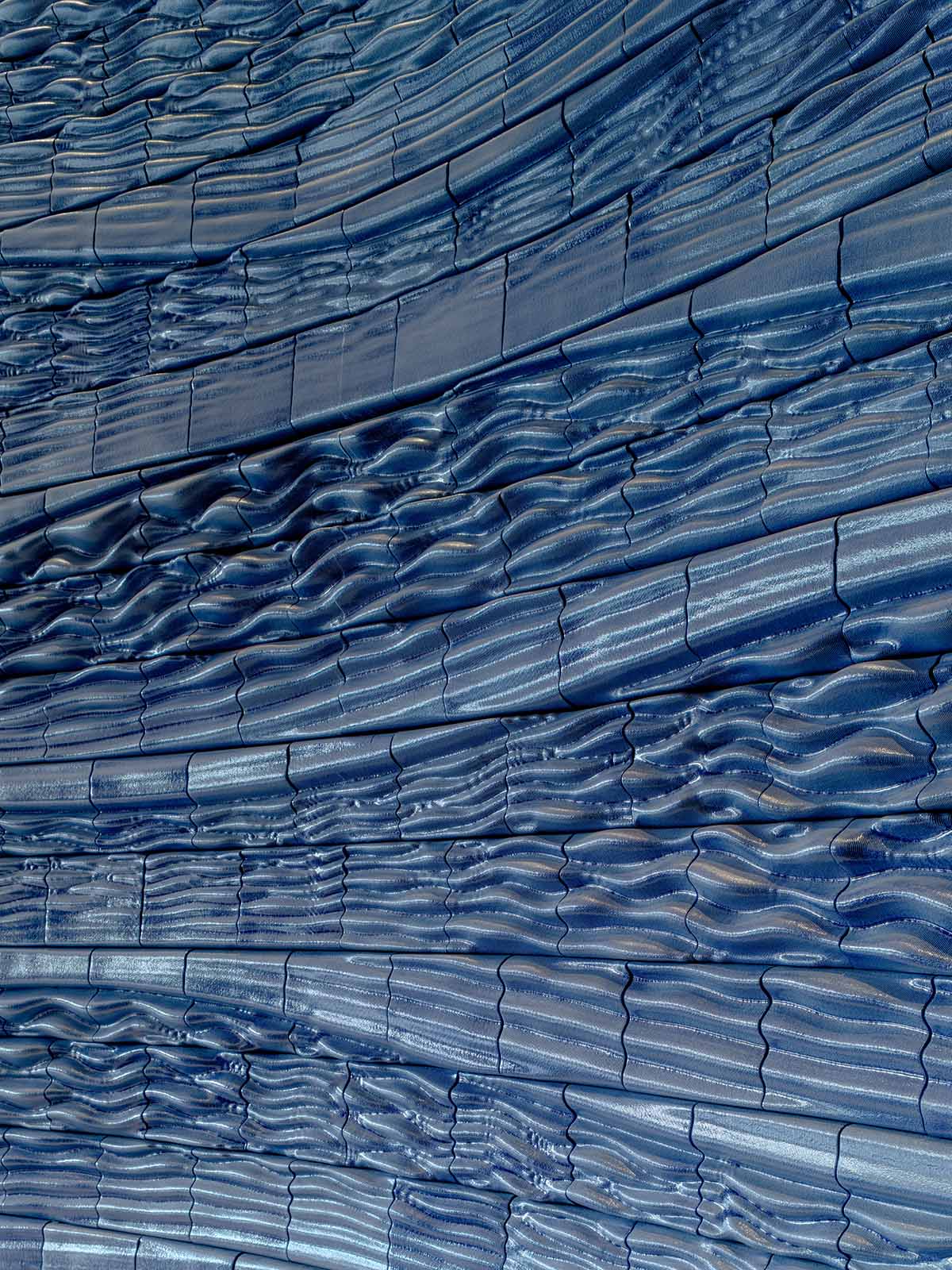 Studio RAP wraps the entrance of a hotel with majestic 3D printed ceramic walls 