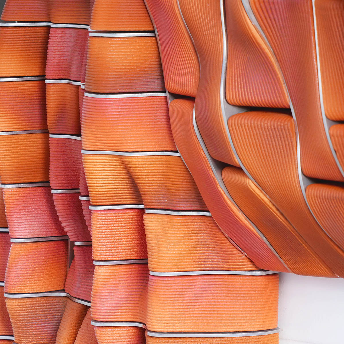 Studio RAP creates façade featuring bespoke 3D-printed ceramic tiles and bricks