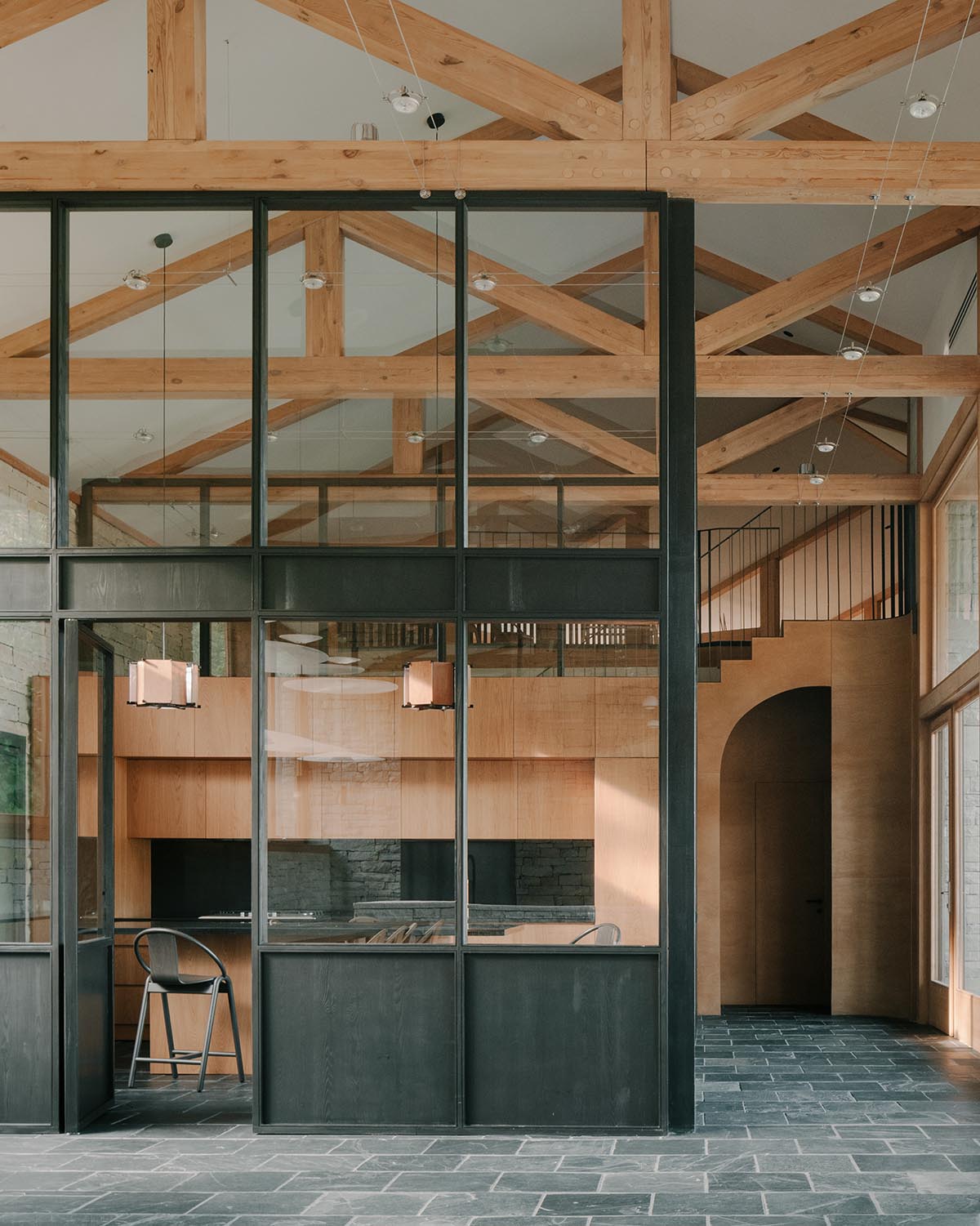 The stone and wood Tbilisi residence integrates architecture with the natural landscape