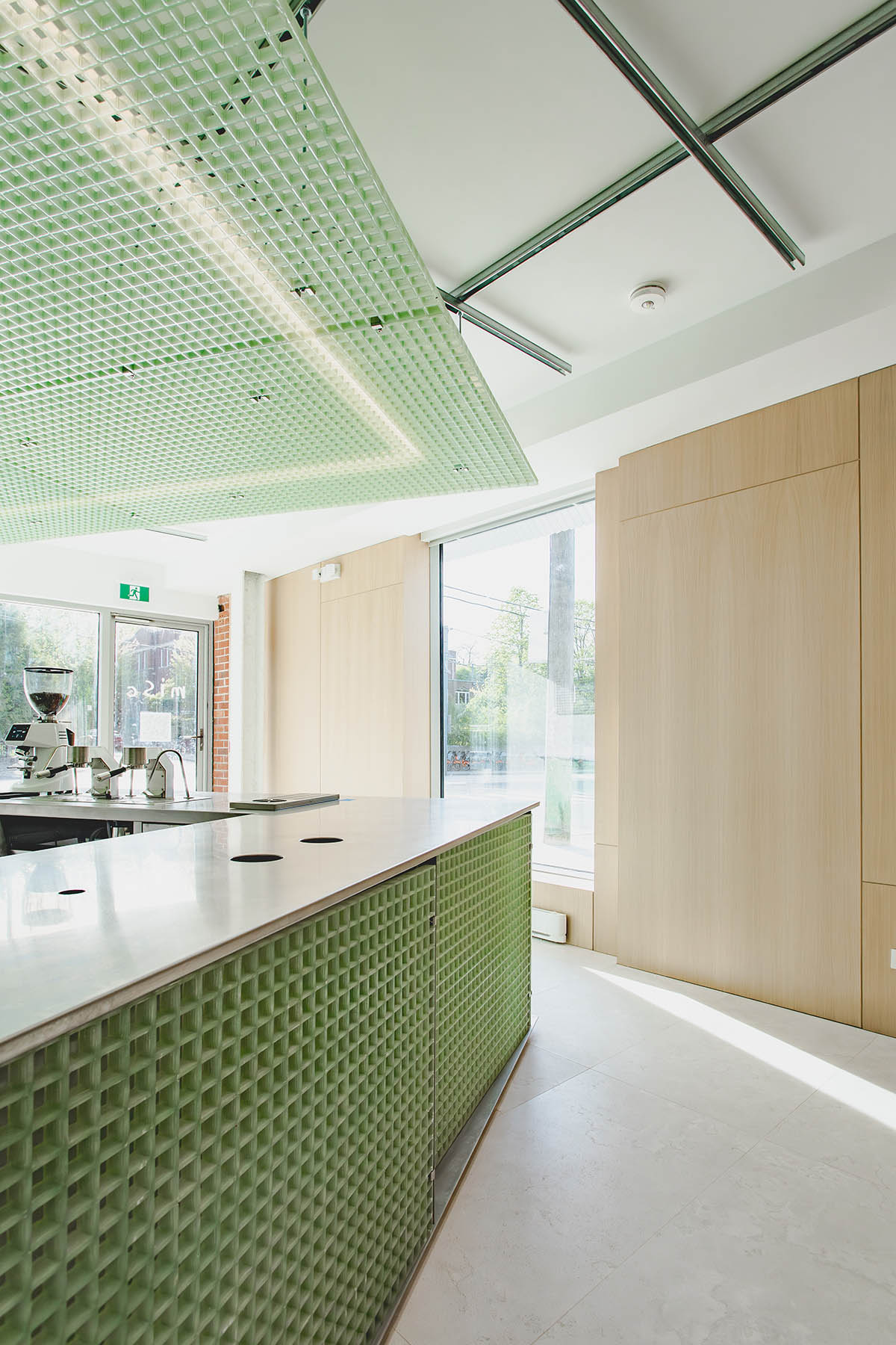 Misc Coffee makes a bold statement with green translucent bar in a busy street of Toronto