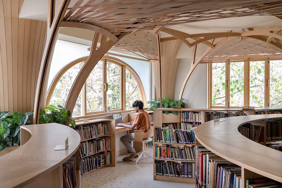 studio Hinge embeds a library under the wooden tree-like canopies in Mumbai