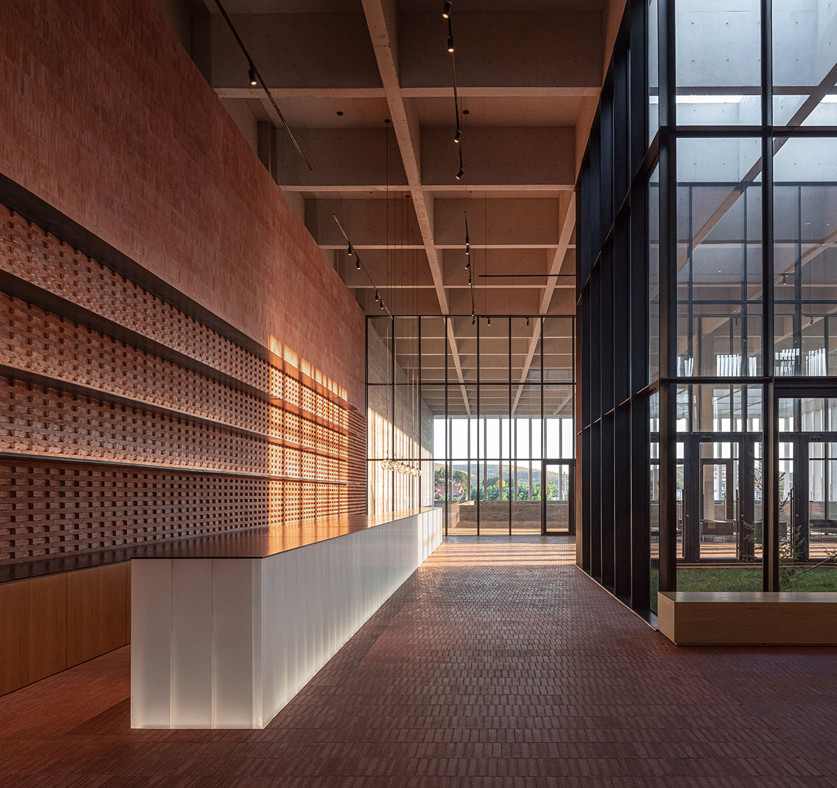 Grey brick walls wrap a factory building referencing to local construction methods in China 