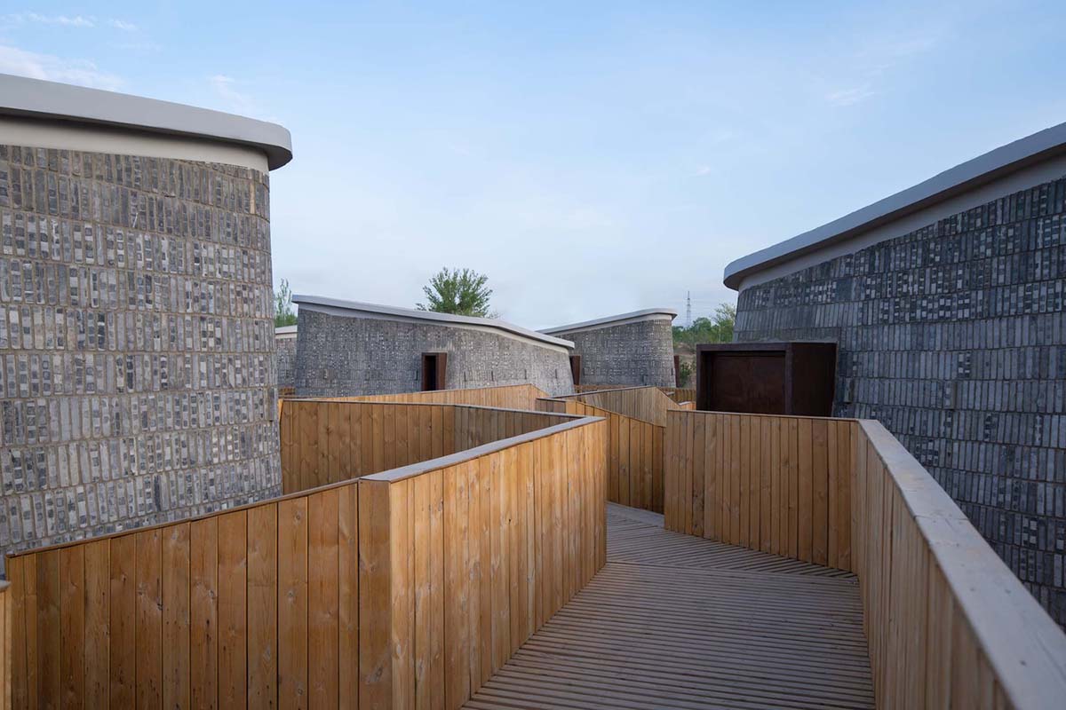 Hyperbolic vertical grottos are activated by a network of floating wooden bridges in China