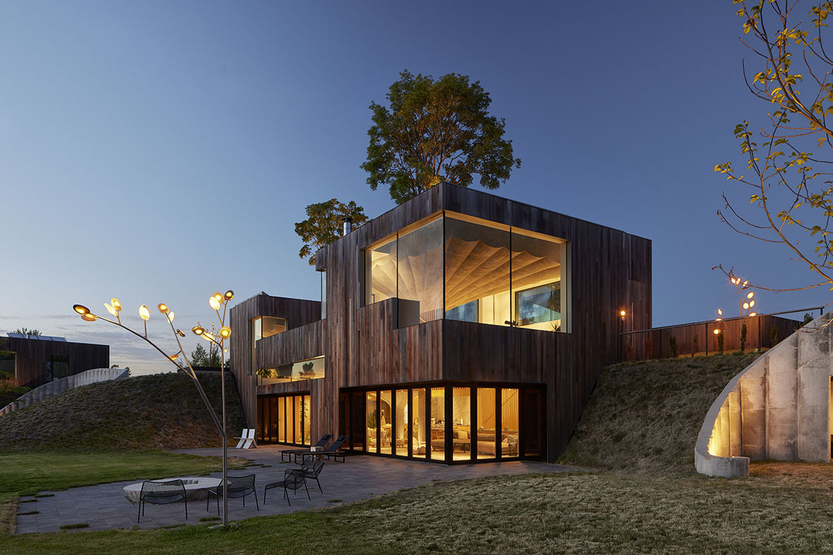 Omer Arbel shapes family home around monumental lily pad columns on a hayfield in Canada