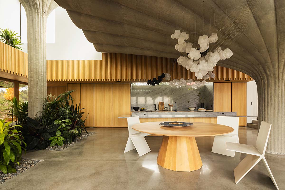 Omer Arbel shapes family home around monumental lily pad columns on a hayfield in Canada
