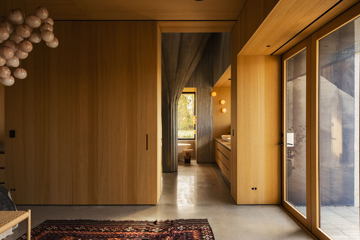Omer Arbel shapes family home around monumental lily pad columns on a hayfield in Canada