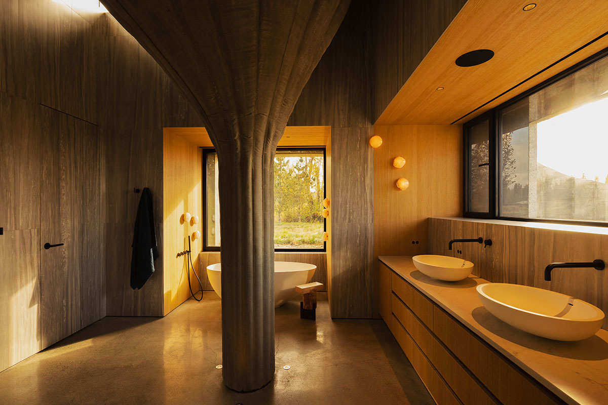 Omer Arbel shapes family home around monumental lily pad columns on a hayfield in Canada