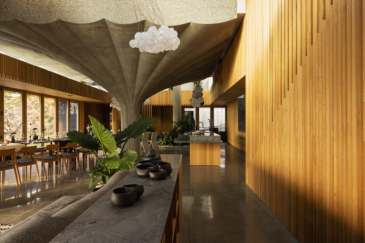 Omer Arbel shapes family home around monumental lily pad columns on a hayfield in Canada