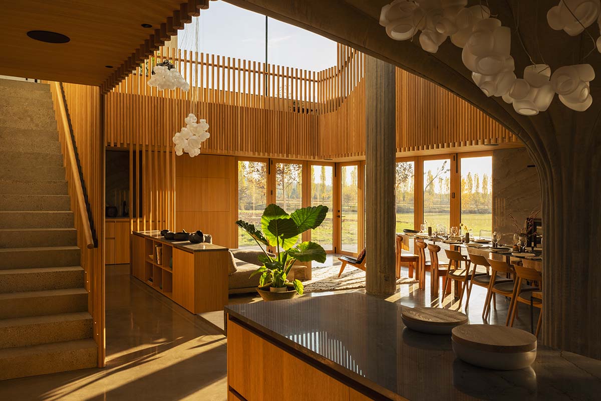 Omer Arbel shapes family home around monumental lily pad columns on a hayfield in Canada