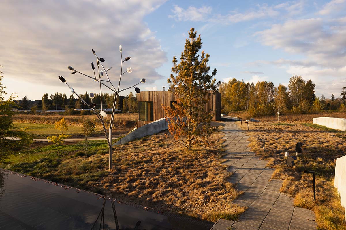Omer Arbel shapes family home around monumental lily pad columns on a hayfield in Canada