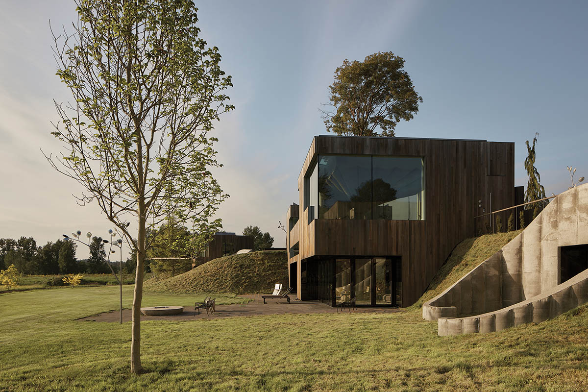 Omer Arbel shapes family home around monumental lily pad columns on a hayfield in Canada