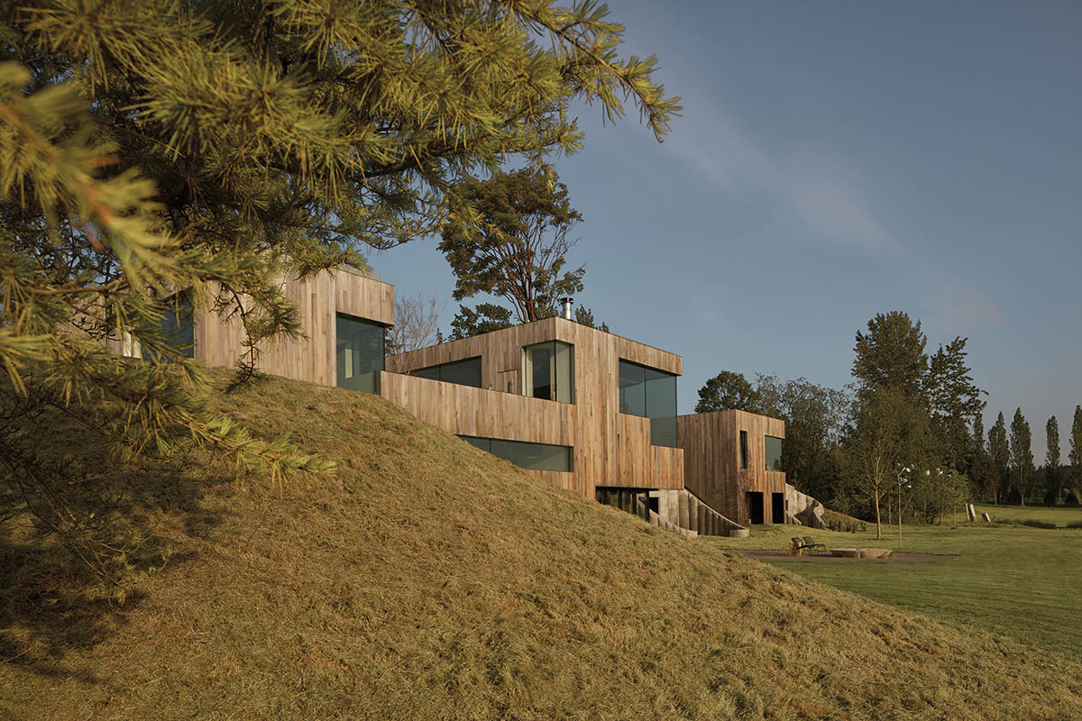 Omer Arbel shapes family home around monumental lily pad columns on a hayfield in Canada
