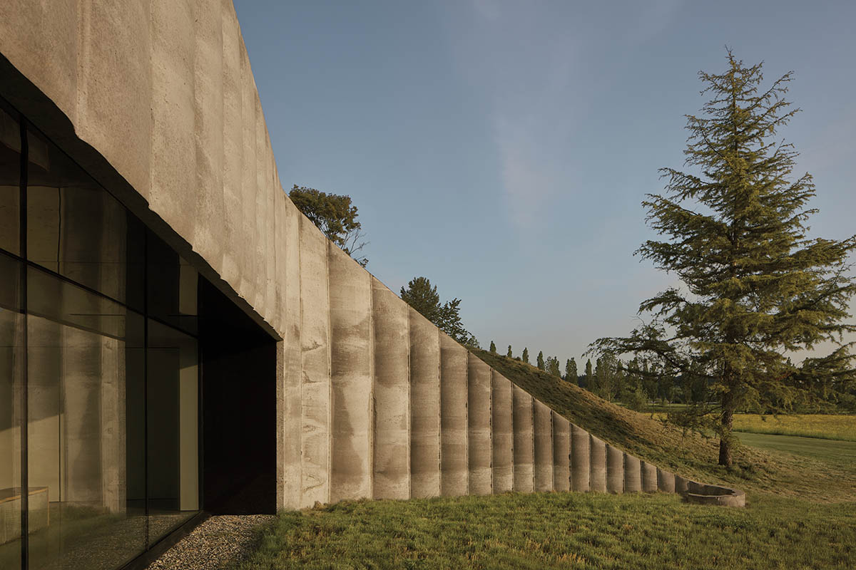 Omer Arbel shapes family home around monumental lily pad columns on a hayfield in Canada