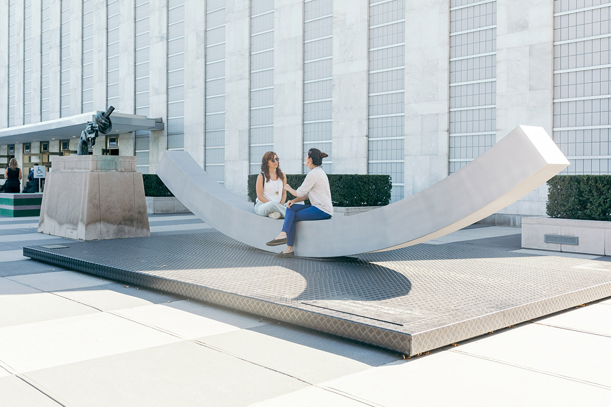 Snøhetta designed arc-shaped urban peace bench for the UN Headquarters Plaza in New York City