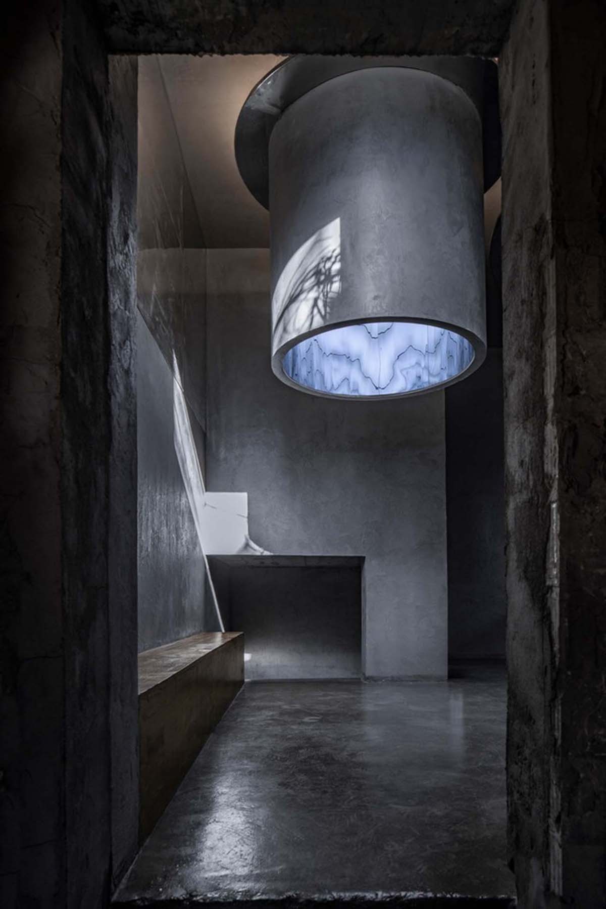 Linkchance Architects creates coffee store and art studio with golden metallic interiors in Beijing