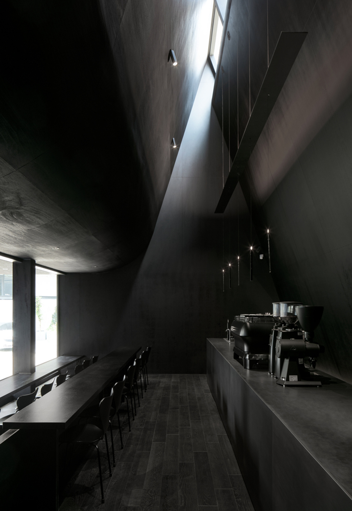 WGNB uses achromatic color of black for partly triangular-designed fashion store in Seoul