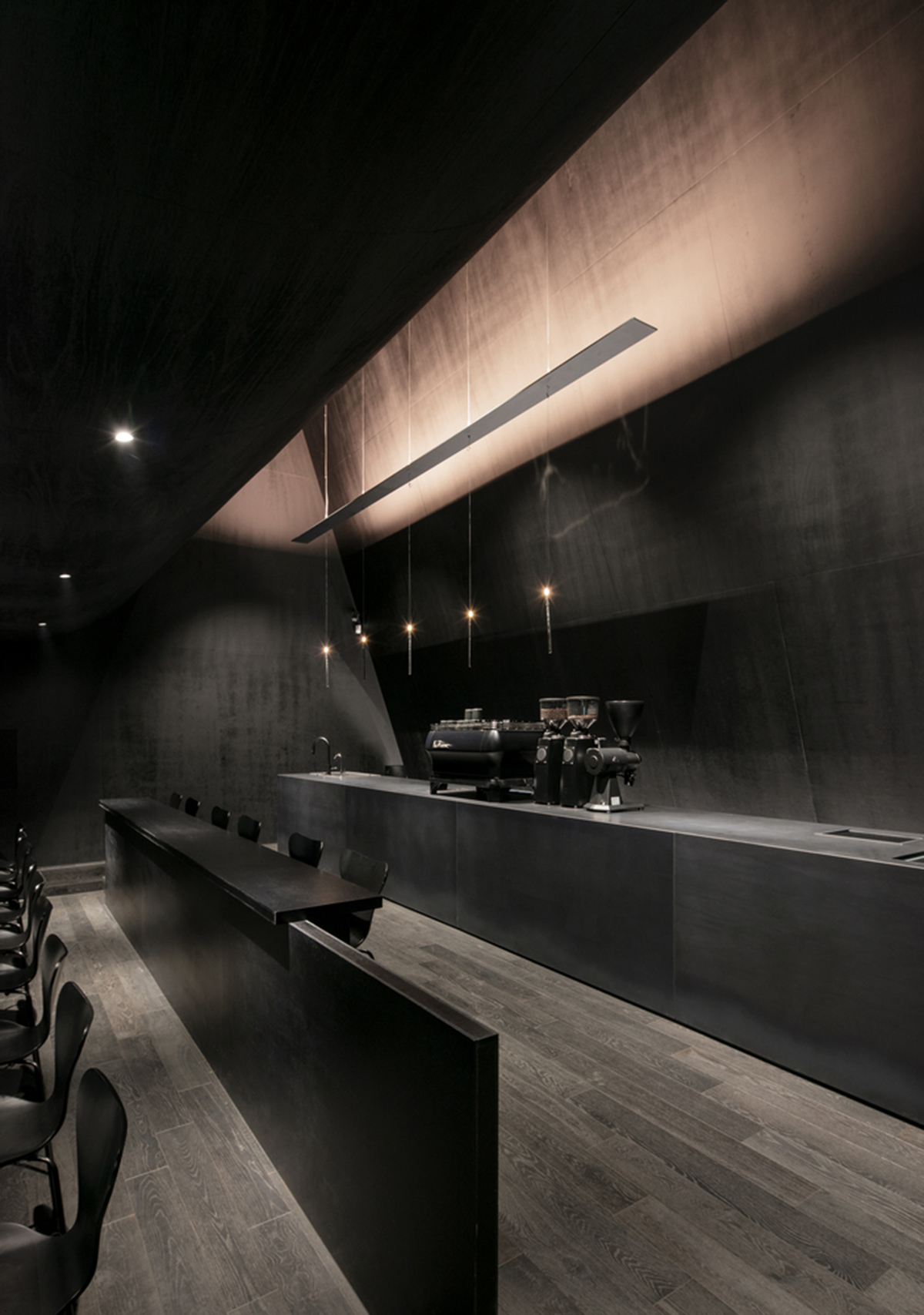 WGNB uses achromatic color of black for partly triangular-designed fashion store in Seoul