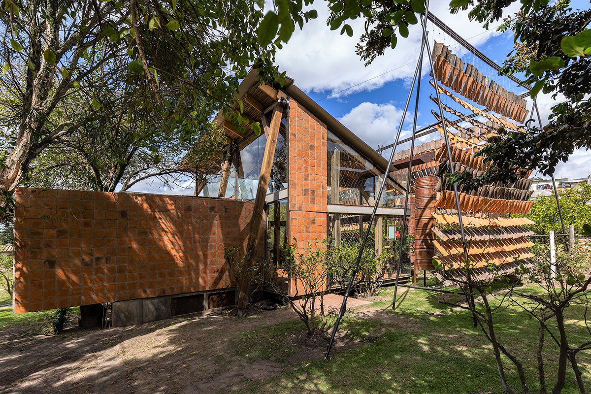 Daniel Moreno Flores creates welcoming screen with hanging tiles to mark this house in Ecuador