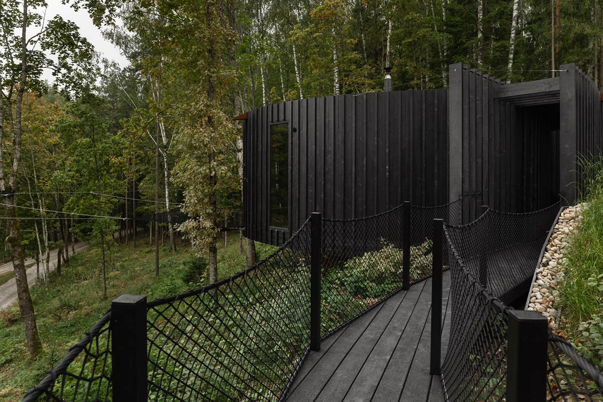 OPEN AD designs black timber Wool Sauna at a resort in Latvia 