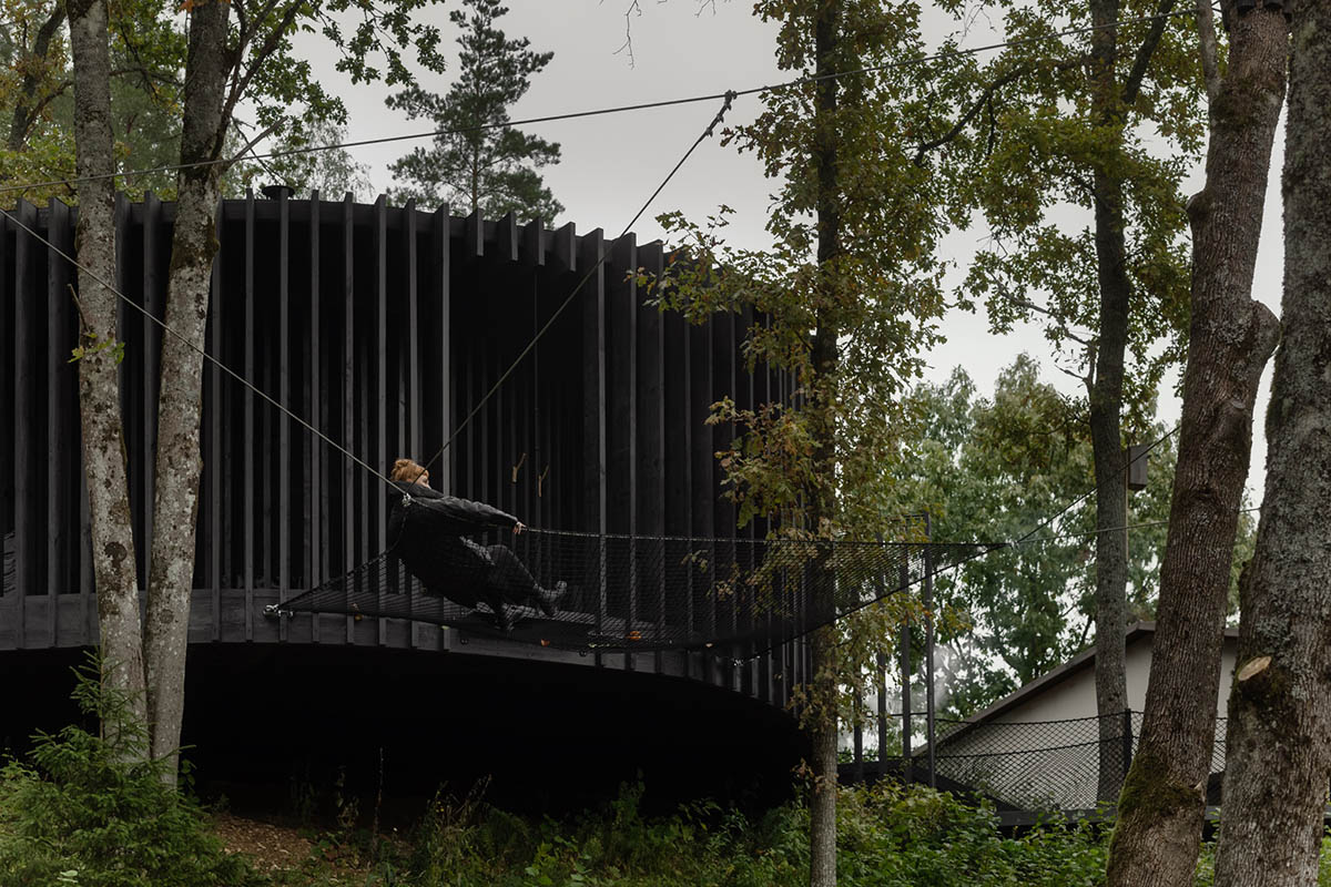 OPEN AD designs black timber Wool Sauna at a resort in Latvia 