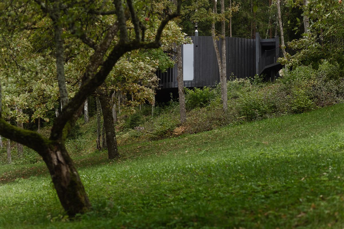 OPEN AD designs black timber Wool Sauna at a resort in Latvia 