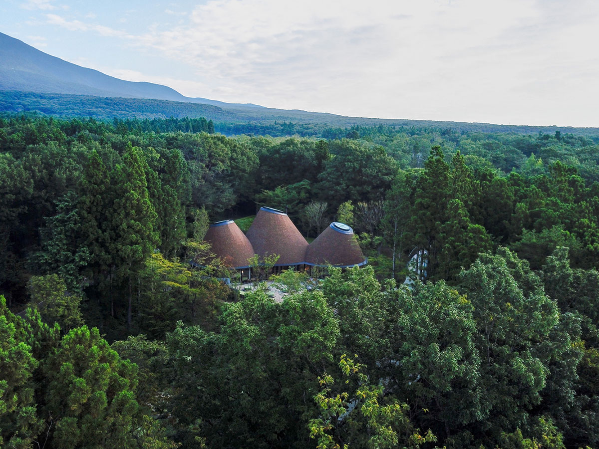This club house by Klein Dytham Architecture offers serene atmosphere within lush forest in Japan