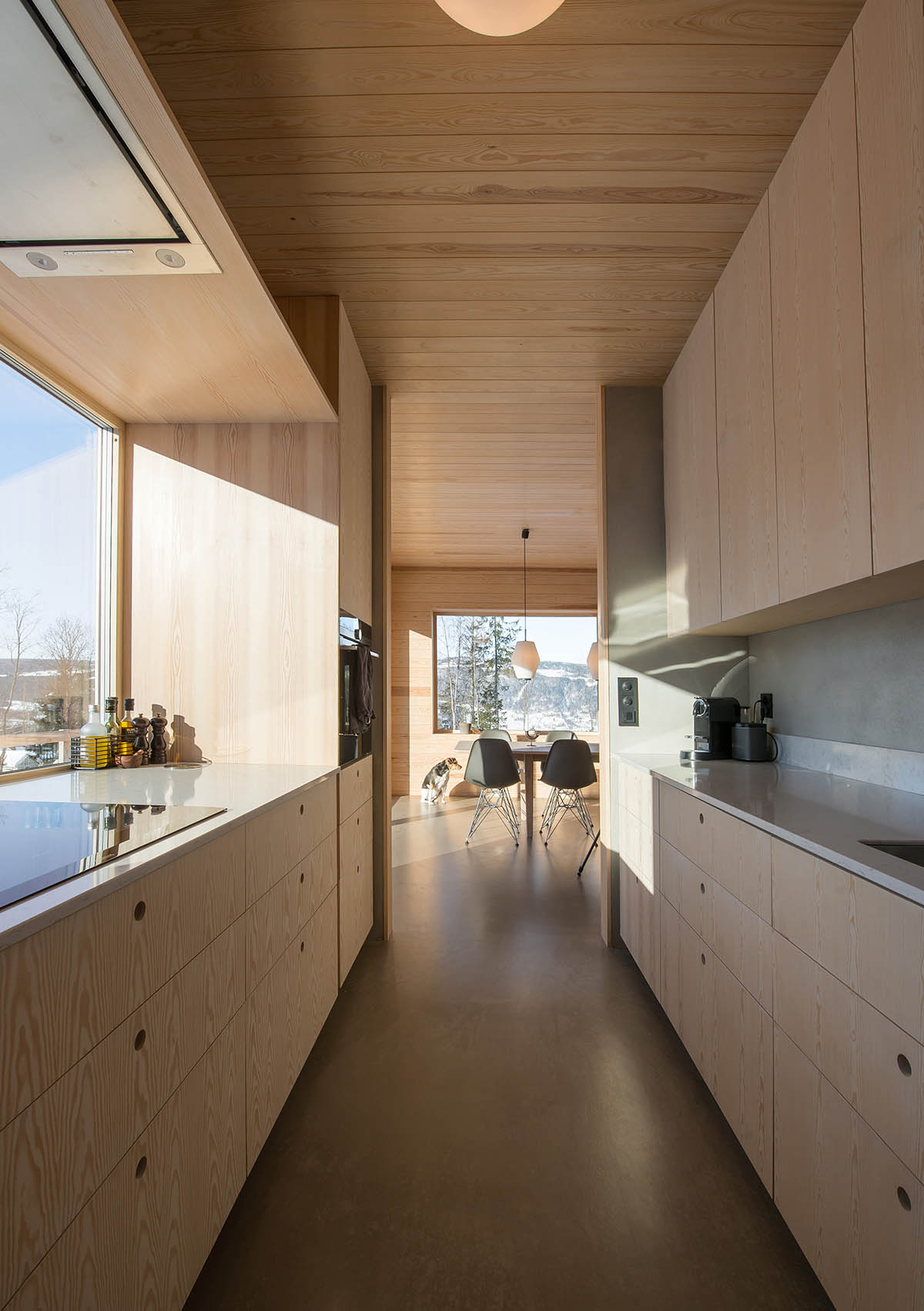  Sanden+Hodnekvam Architects built family house wrapped by red pigmented concrete panels in Norway