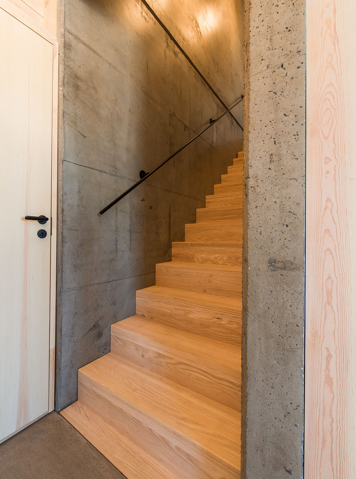  Sanden+Hodnekvam Architects built family house wrapped by red pigmented concrete panels in Norway