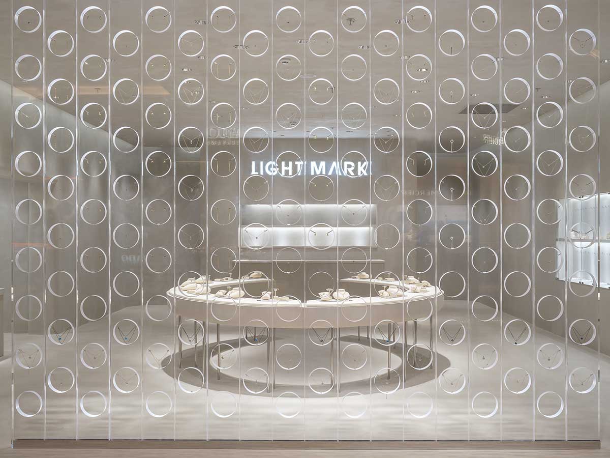 kooo architects adds transparent floating halos as a screen to jewelry store in Suzhou 