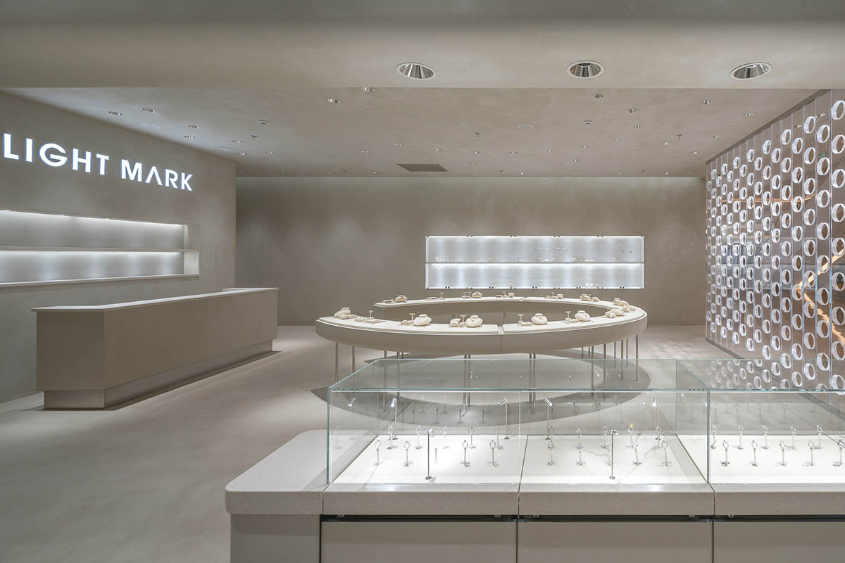 kooo architects adds transparent floating halos as a screen to jewelry store in Suzhou 
