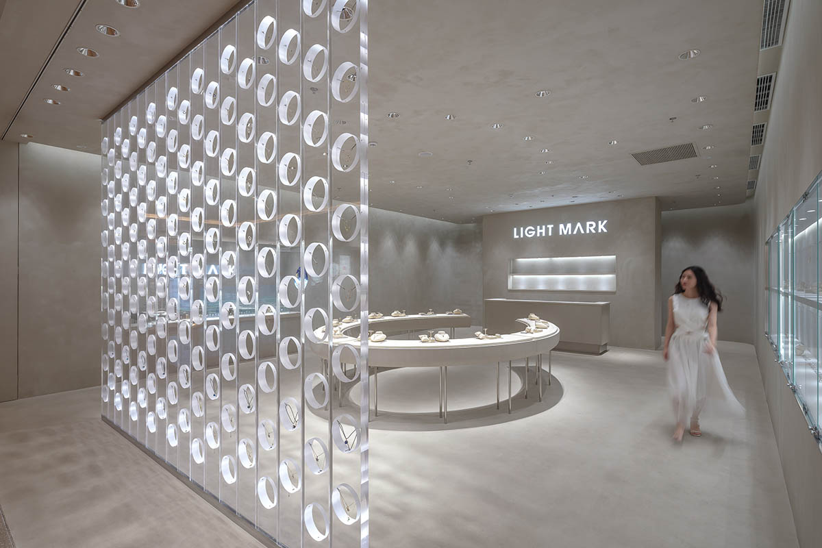 kooo architects adds transparent floating halos as a screen to jewelry store in Suzhou 