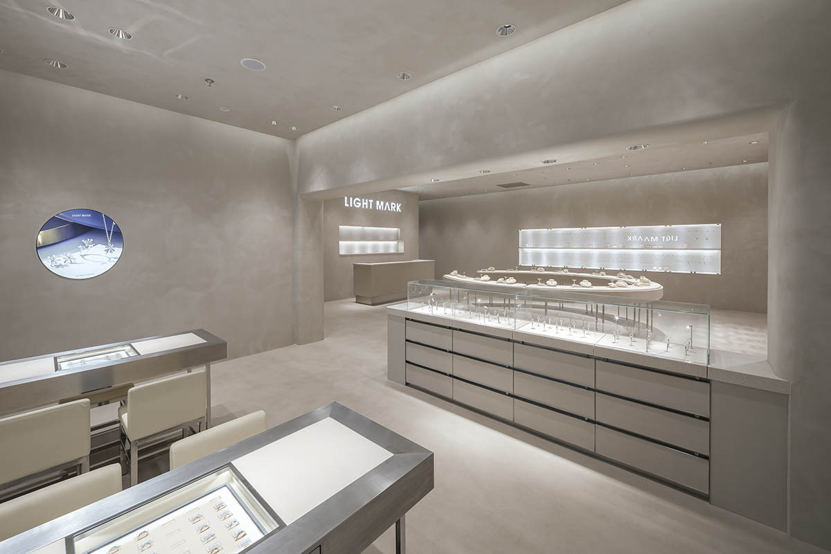 kooo architects adds transparent floating halos as a screen to jewelry store in Suzhou 