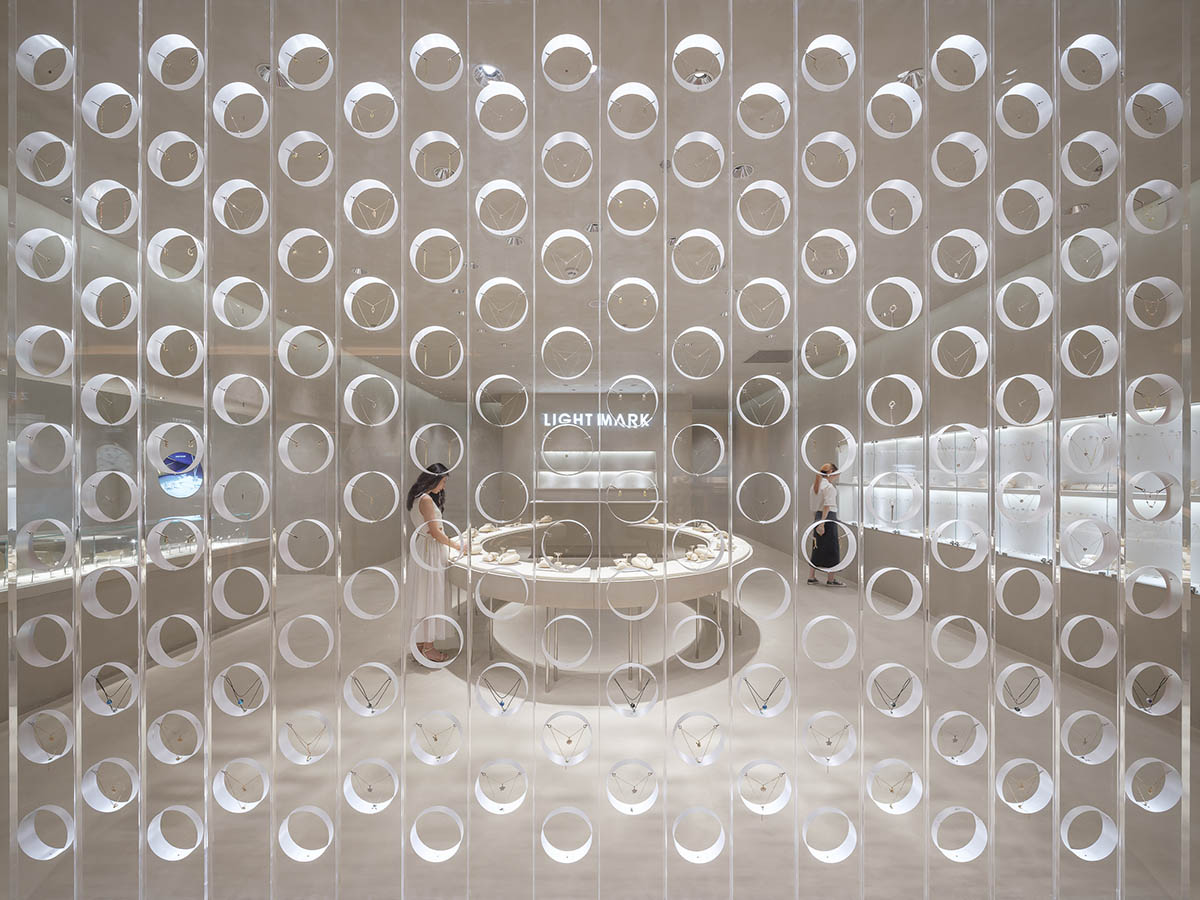 kooo architects adds transparent floating halos as a screen to jewelry store in Suzhou 