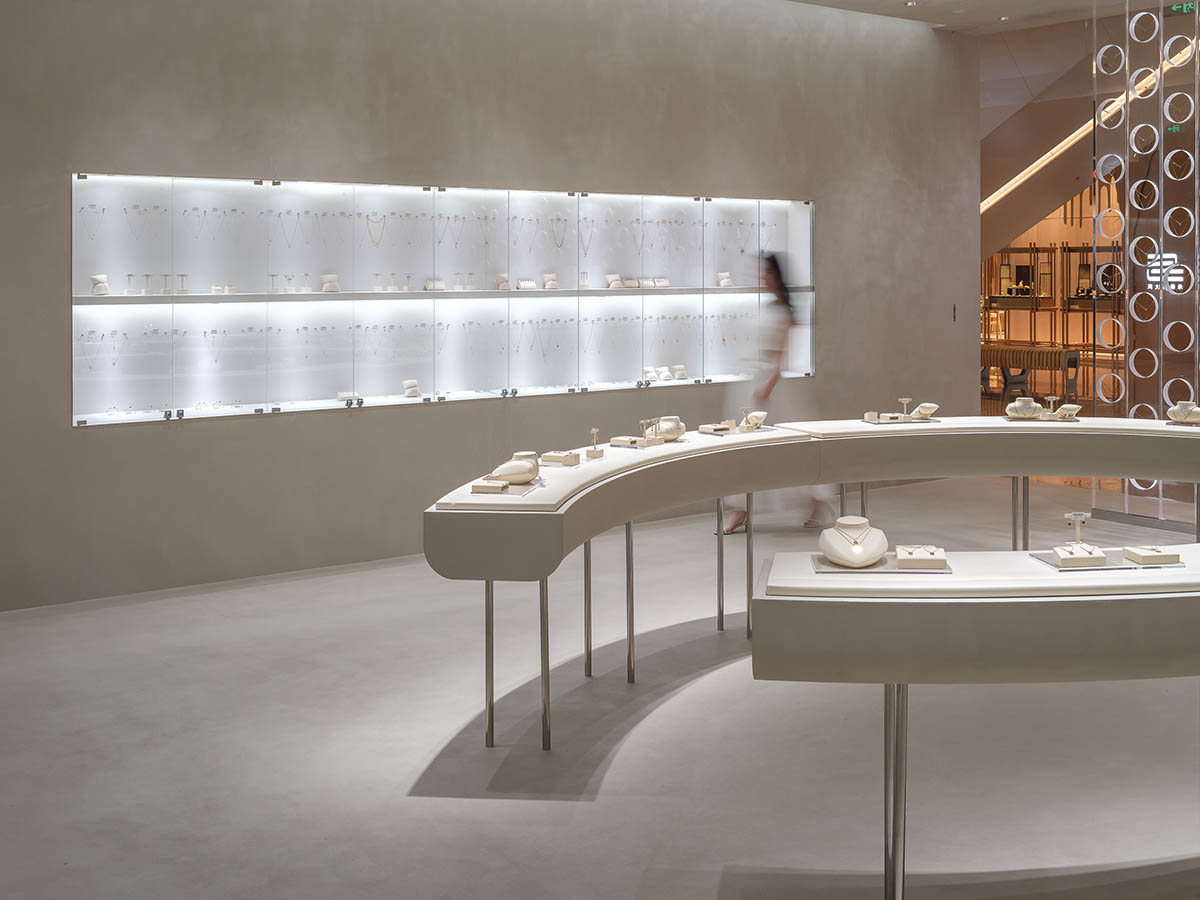 kooo architects adds transparent floating halos as a screen to jewelry store in Suzhou 