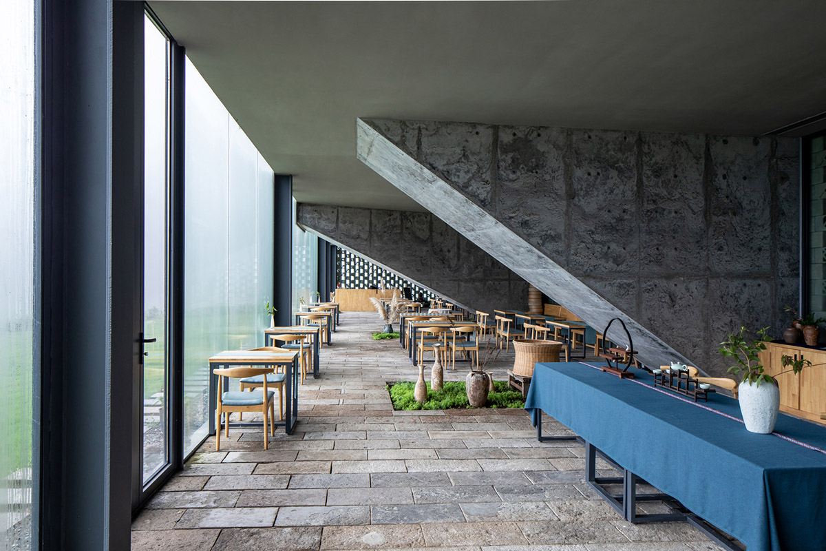 Eight diagonal light tubes are protruding from tea house to grasp prolonged sunlight hours by DnA